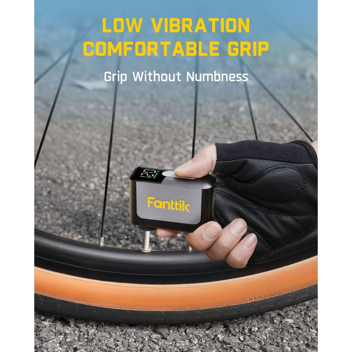 Fanttik X10 Ace mini bike pump with low vibration and comfortable grip, attached to a bicycle tire.