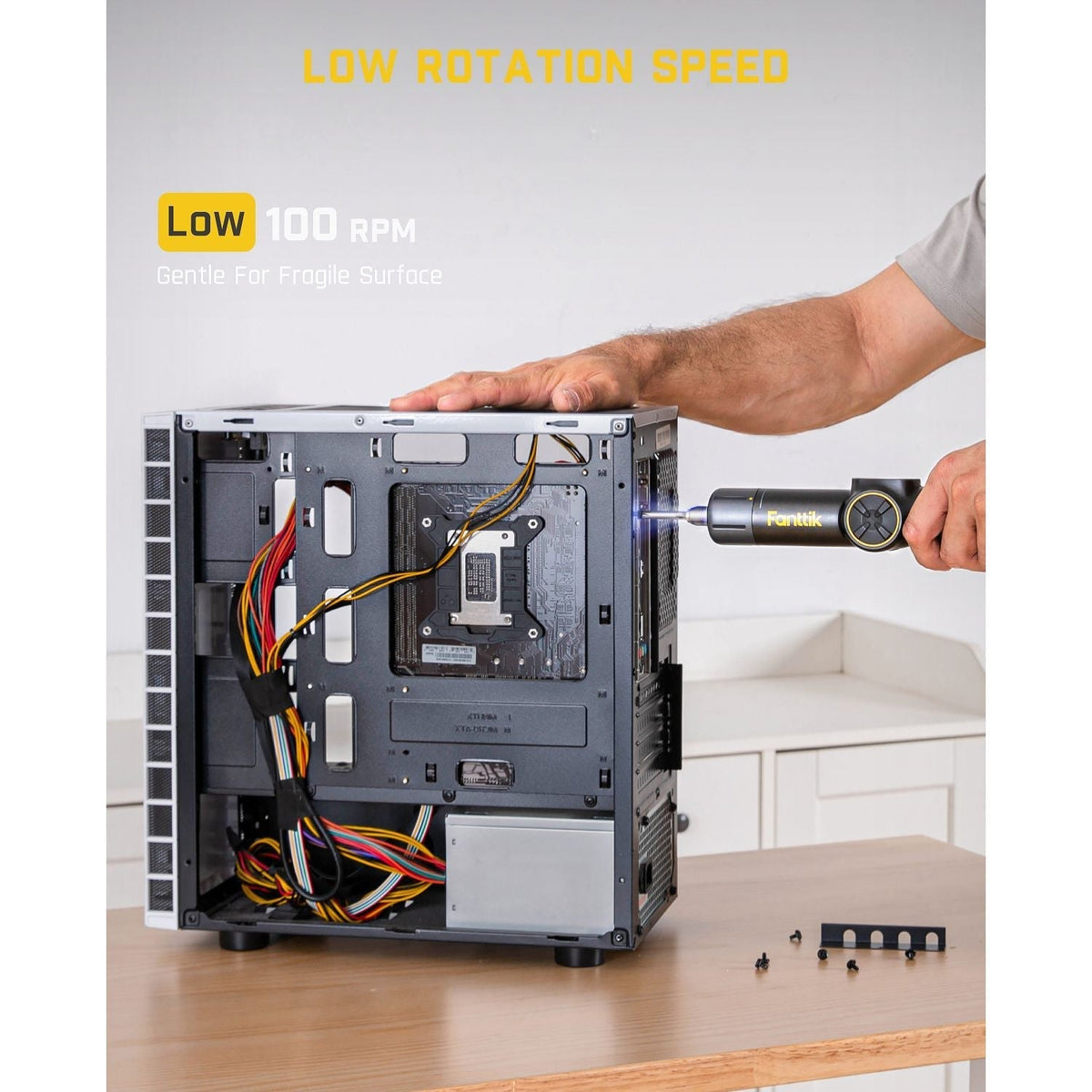 Fanttik Fold S1 APEX cordless screwdriver with low 100 RPM speed gently working inside a computer tower.