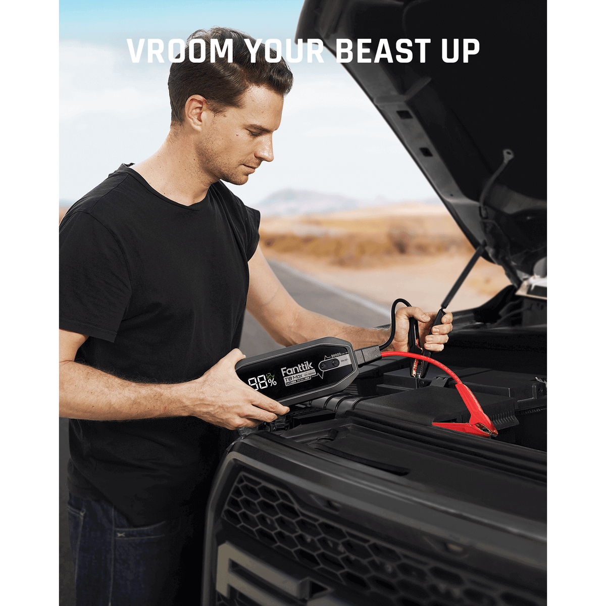 Man using Fanttik T8 MAX 4000 Amp jump starter with 98% battery on car engine